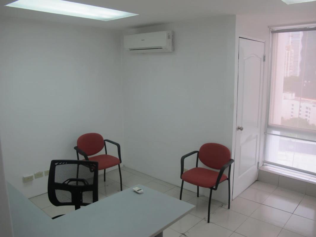 Private office space with large window overlooking Panama City skyline in Torre Delta