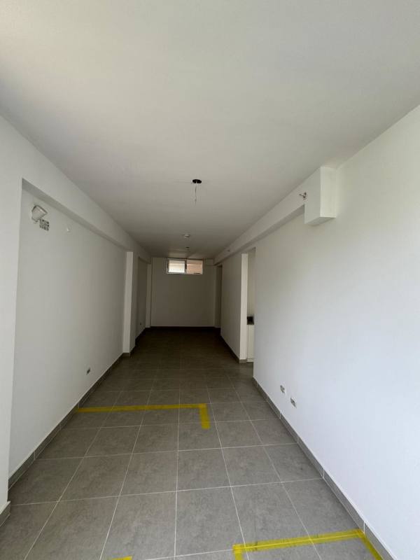 Indoor parking garage with tiled floor at Residencial Las Acacias Don Bosco Panama