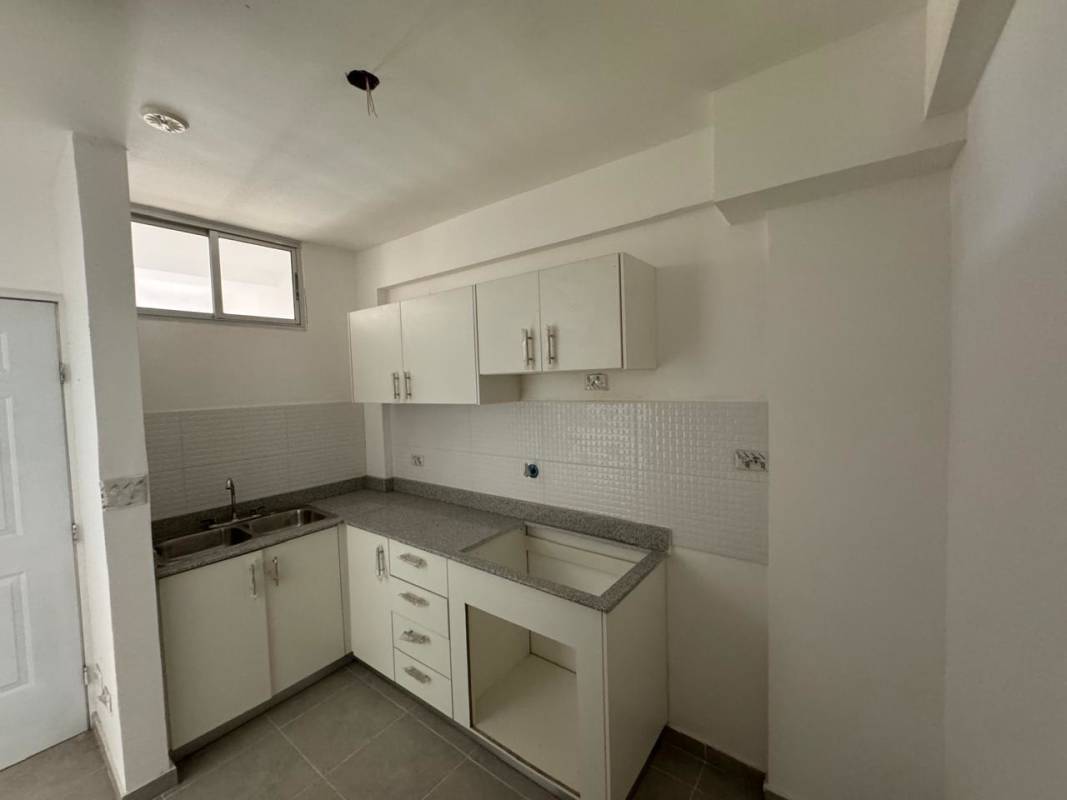 Modern kitchen with granite countertop double sink white cabinets Las Acacias Don Bosco Panama