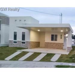 Bright living room with sliding doors leading to terrace The Village Beach Residences Panama