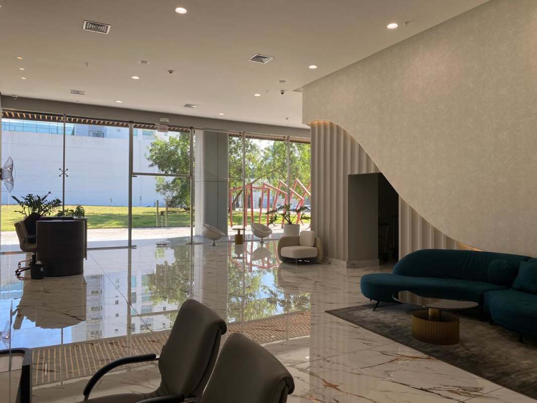 Modern double-height lobby with marble floors, designer lighting at PH Arcadia Costa del Este