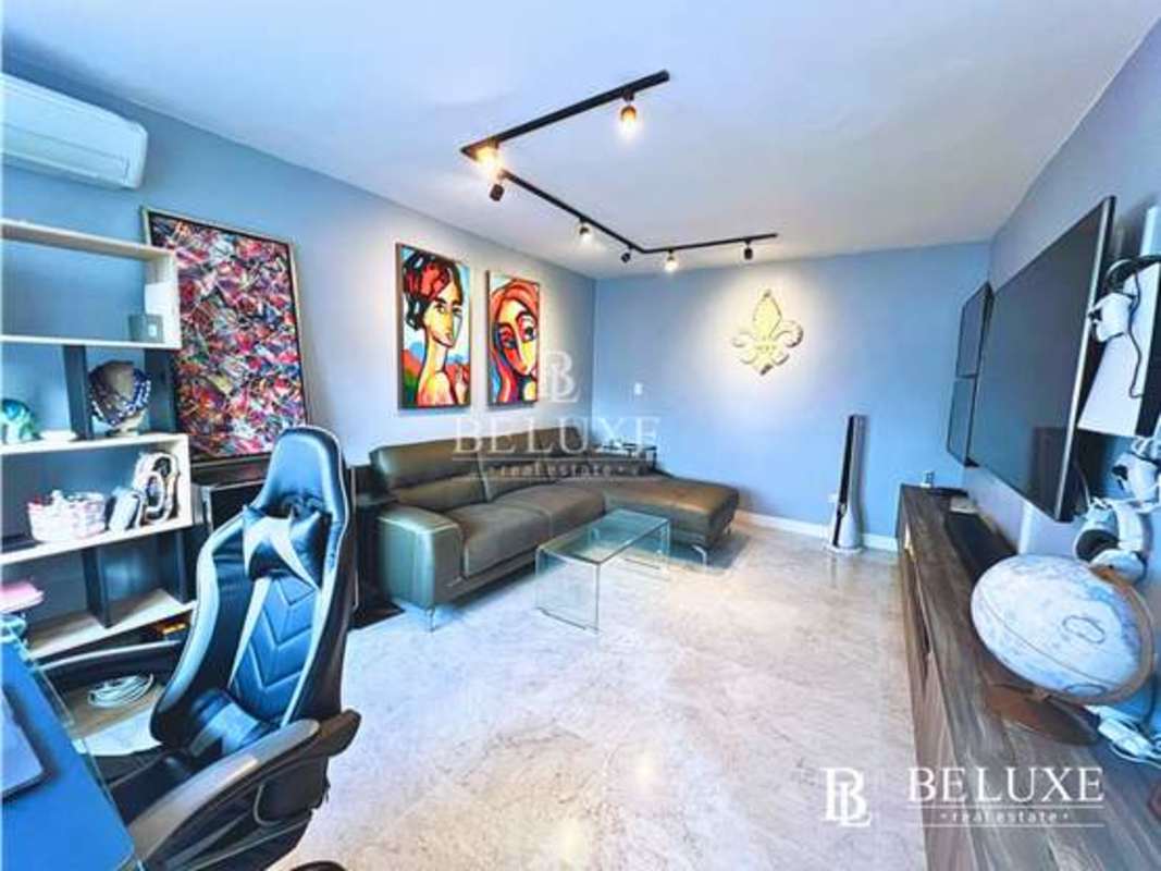 Master bathroom with marble finishes, dual sinks and glass shower in PH Lalique Punta Paitilla Panama