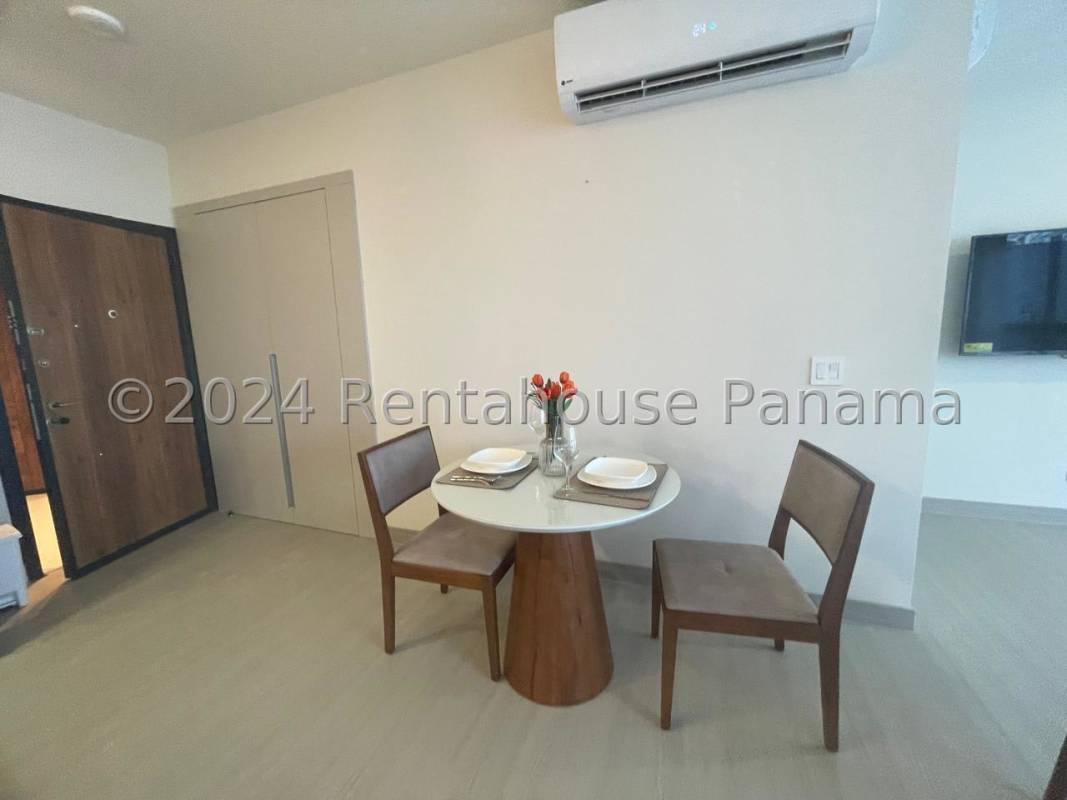 Open kitchen with granite countertops and stainless appliances in PH Arcadia apartment