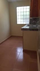 Small kitchen with glass block window in apartment for rent David Chiriquí
