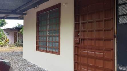 Secure entry apartment with wooden door and barred window in David Chiriquí for rent