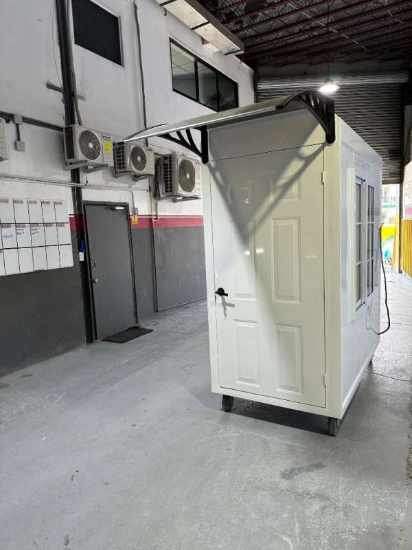 Inside warehouse showing prefab portable cabin used as mobile office Costa del Este Panama