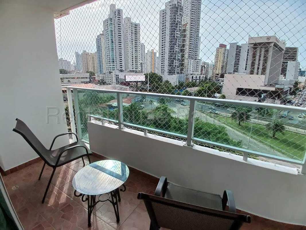 Private balcony with seating and safety netting at PH San Francisco Bay Panama apartment