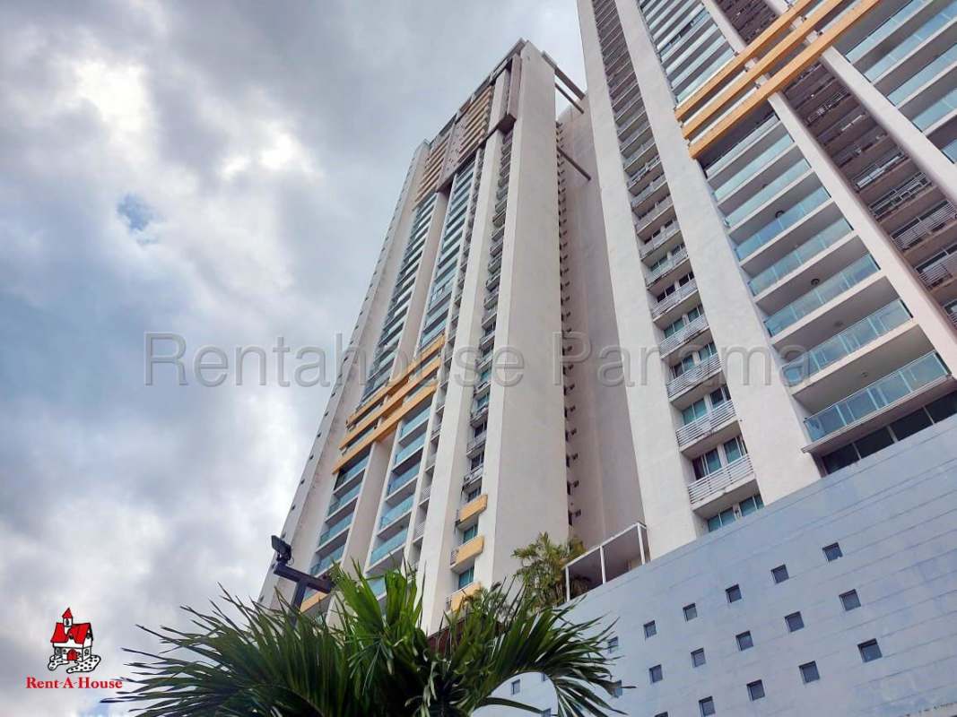 Facade of PH San Francisco Bay high-rise condominium with balconies and orange accents against sky