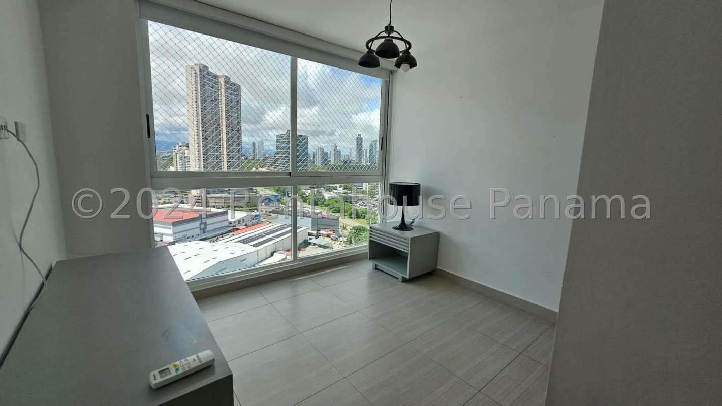 Bright open plan living dining area with ceramic floors and balcony access PH Pacific Point Panama City