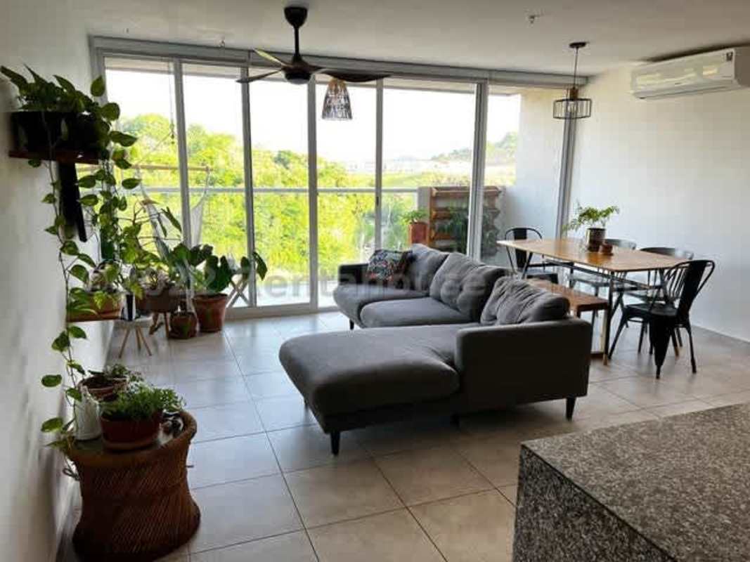 Covered balcony overlooking greenery in PH Hacienda Golf II Brisas del Golf Panama City