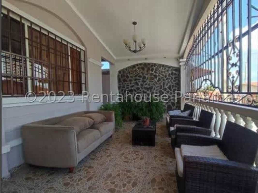 Large covered patio terrace with tiled floors at Vista del Valle Villa Lucre Panama