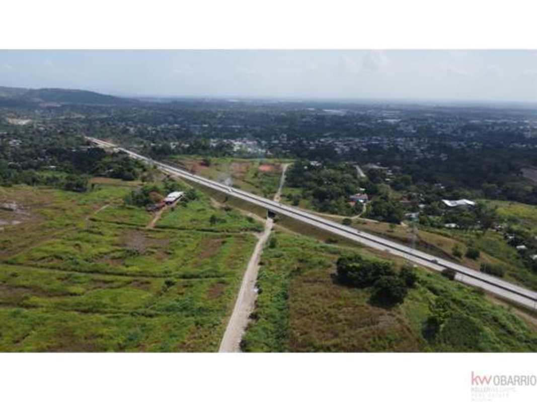 Open cleared lot near major road infrastructure with distant skyline Panama