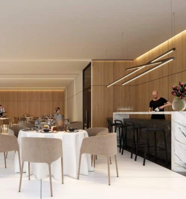 Sophisticated dining space with light wood finishes and marble bar in PH Paitilla Sky Punta Paitilla Panama