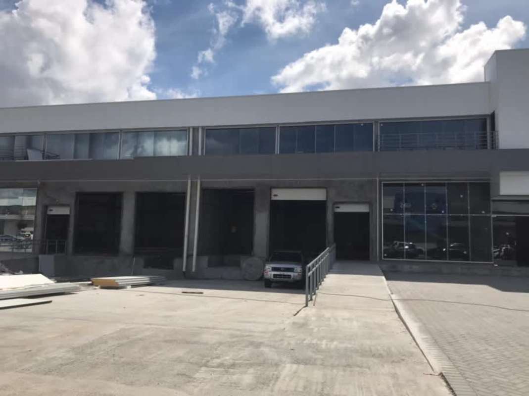 Concrete mezzanine inside warehouse with metal railing and red sprinkler pipes Costa Sur Panama