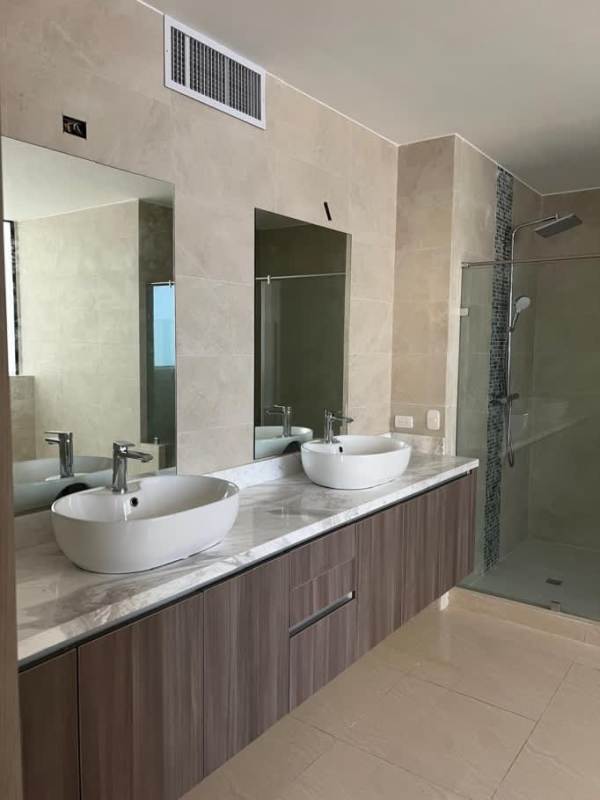 Luxury bathroom with marble tiles, double vanity, walk-in glass shower in PH The Plaza Punta Paitilla
