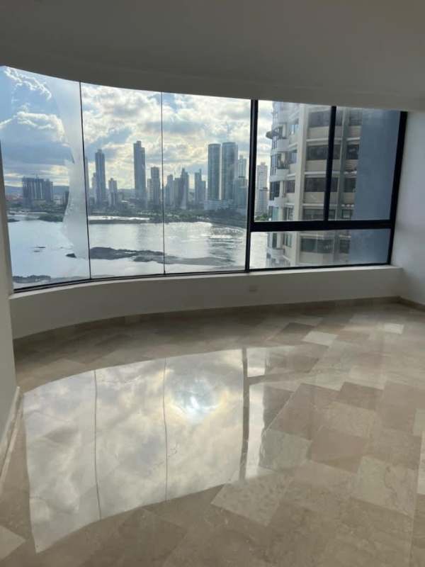 Large bedroom with built-in closets, sea views, and ensuite bath at PH The Plaza Punta Paitilla