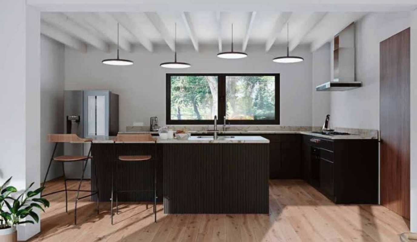 Contemporary kitchen with island, pendant lights, large windows, granite counters in Ancon residence Panama