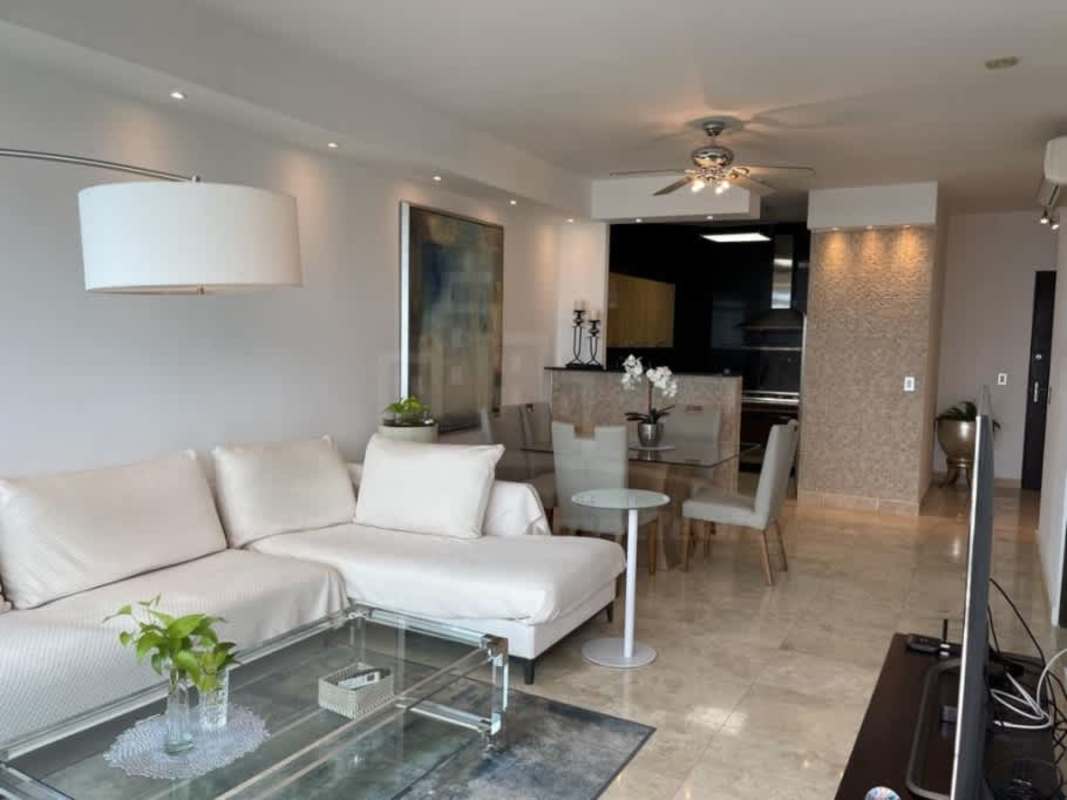 Bright living area with panoramic bay views, marble floor, designer furniture at PH BICSA tower.
