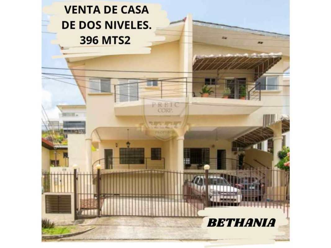 Two-story cream colored house with gated entrance balcony and covered parking sale Bethania Panama