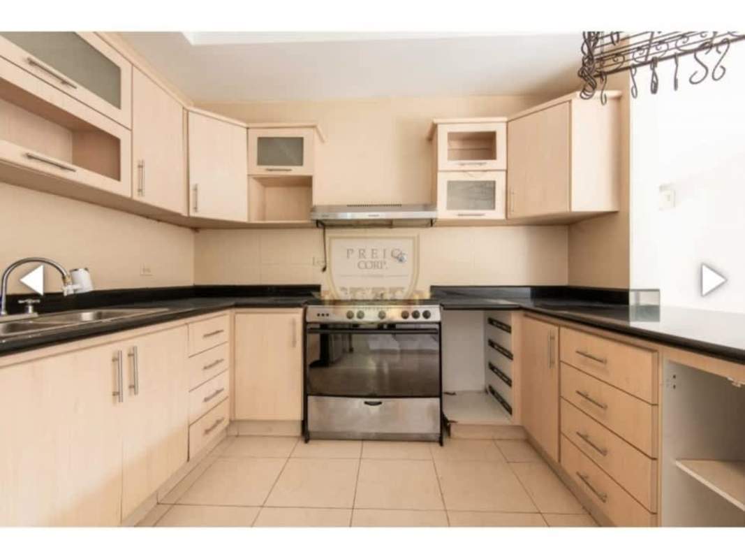 Kitchen with granite countertops stainless steel oven cabinetry tile floor Bethania Panama