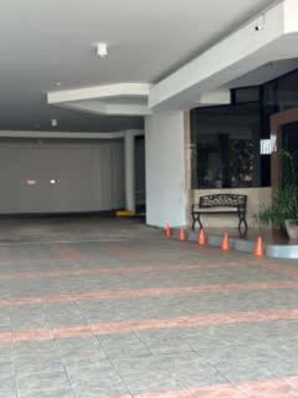 Bright spacious living room with large windows and ocean skyline view in PH Lexus Tower in Coco del Mar