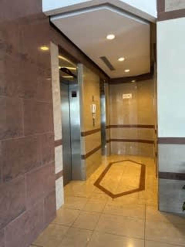 Bathroom with modern tile, walk-in shower glass enclosure PH Lexus Tower