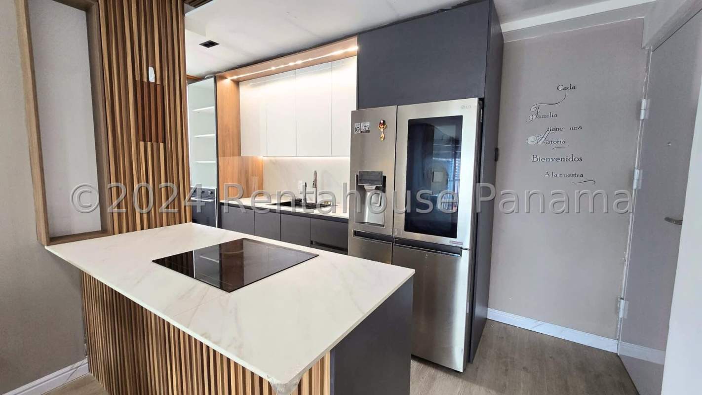 Outdoor swimming pool with sun loungers city skyline view Carrasquilla Plaza Panama City