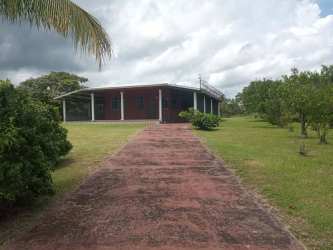 Single story ranch house with covered porch and yard in Antón Coclé Panama