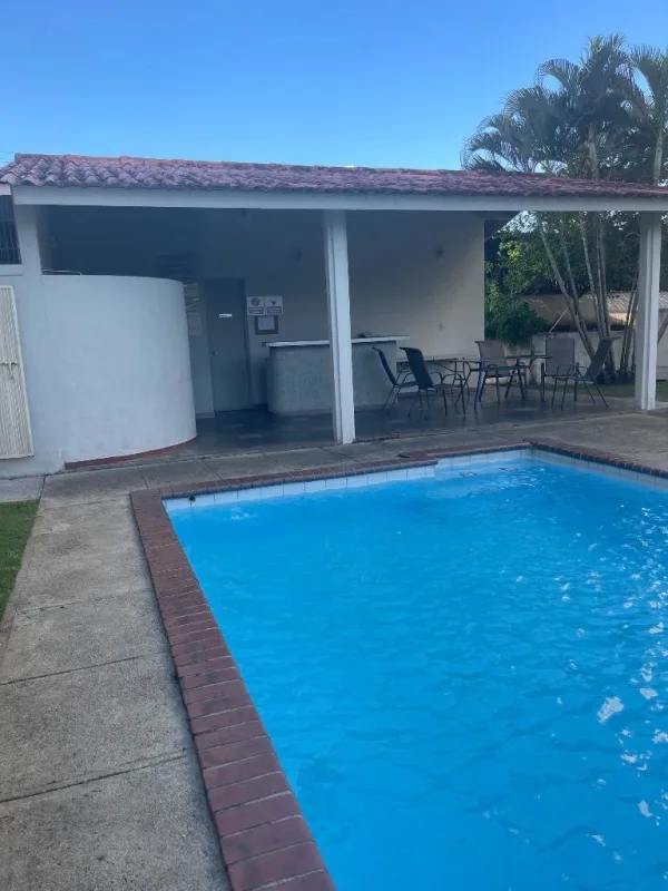 Second bedroom with tile floor, large window, air conditioning in Panama apartment