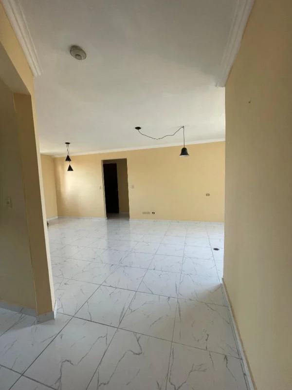 Community swimming pool with sun deck and garden in Panama apartment rental