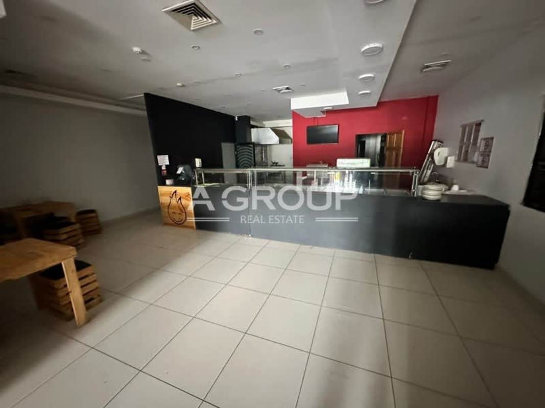 Interior of restaurant commercial space with booths and pendant lighting at Plaza New York Panama City