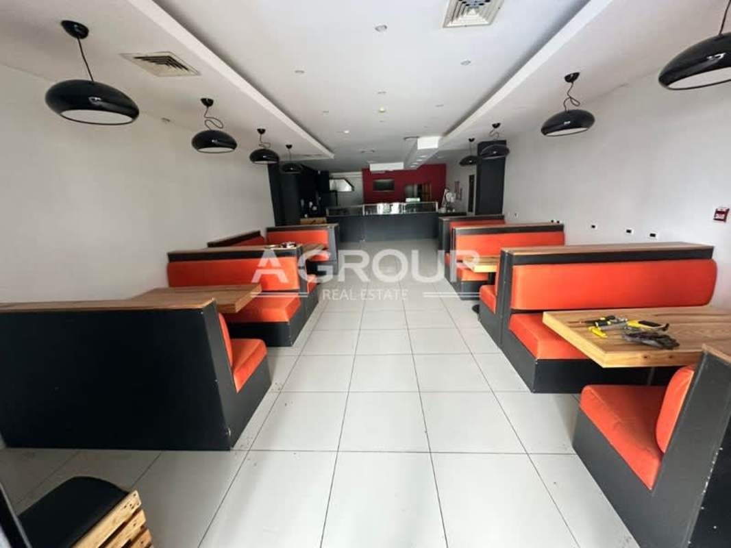 Commercial restaurant service counter with seating and signage inside Plaza New York in Panama City