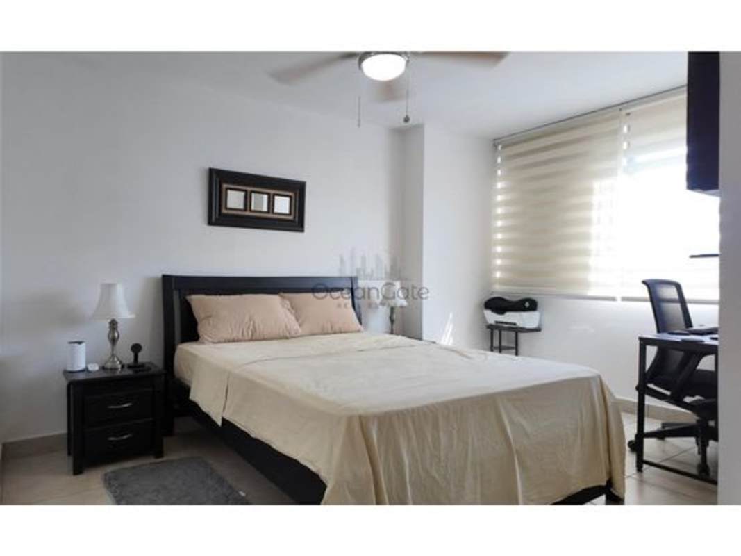 Bedroom furnished with bed, AC, fan and closet in PH Country Club Condado del Rey