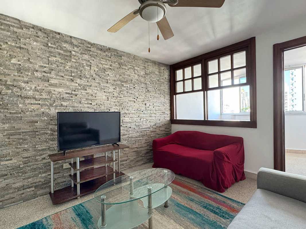 Spacious living dining with stone wall accent ceiling fans PH Orion El Cangrejo for sale