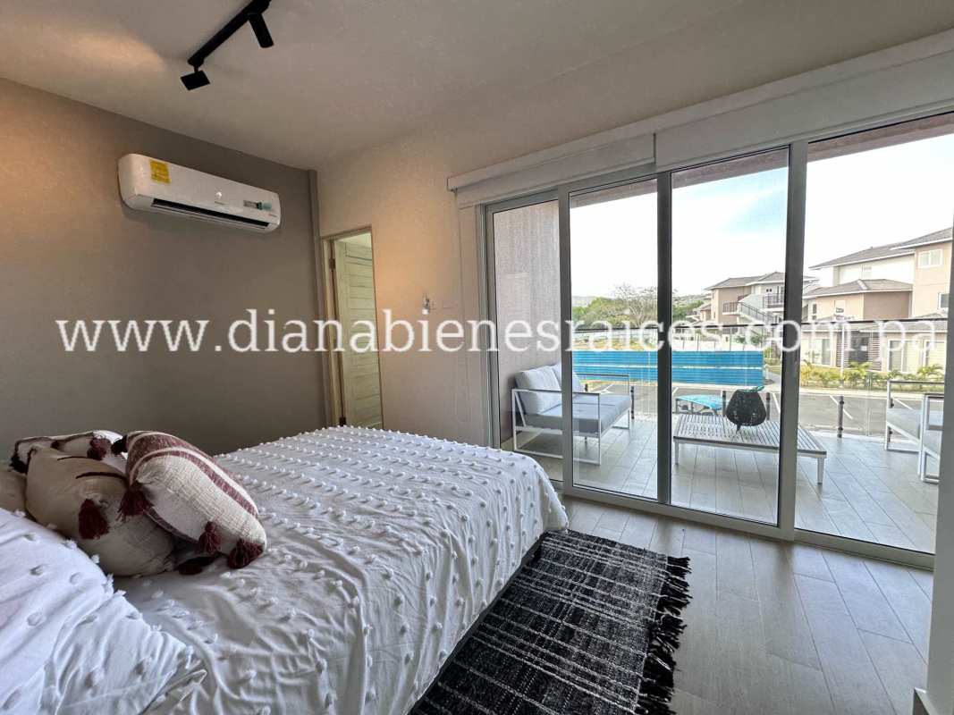 Guest bedroom with natural light in Riviera del Pacífico beach home Gorgona Panama