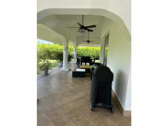 Large kitchen with breakfast bar open concept tile flooring Vistamar Beach Villa Panama