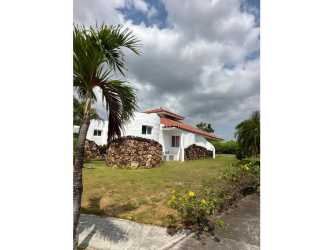 Mediterranean beach villa with red tiled roof lush garden and swimming pool in Vistamar San Carlos Panama