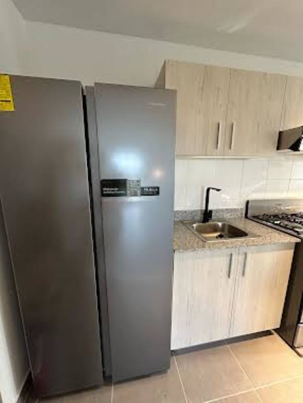 Kitchen with light cabinetry granite counters and stove PH Villa Lucre Panama City apartment