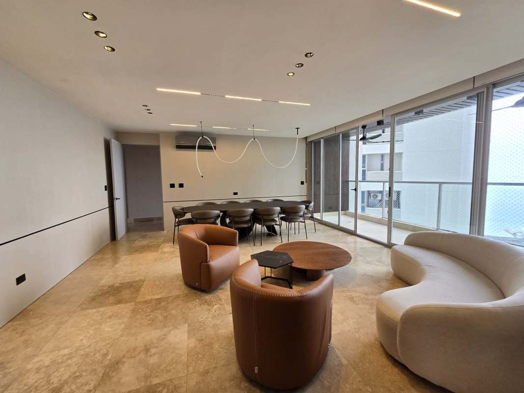 Elegant dining area connected to ocean-view balcony in Punta Pacífica apartment