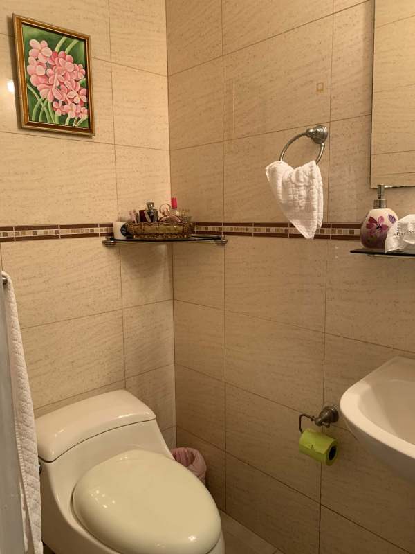 Modern bathroom with beige tiles, granite top, glass shower at PH San Francisco Bay Panama