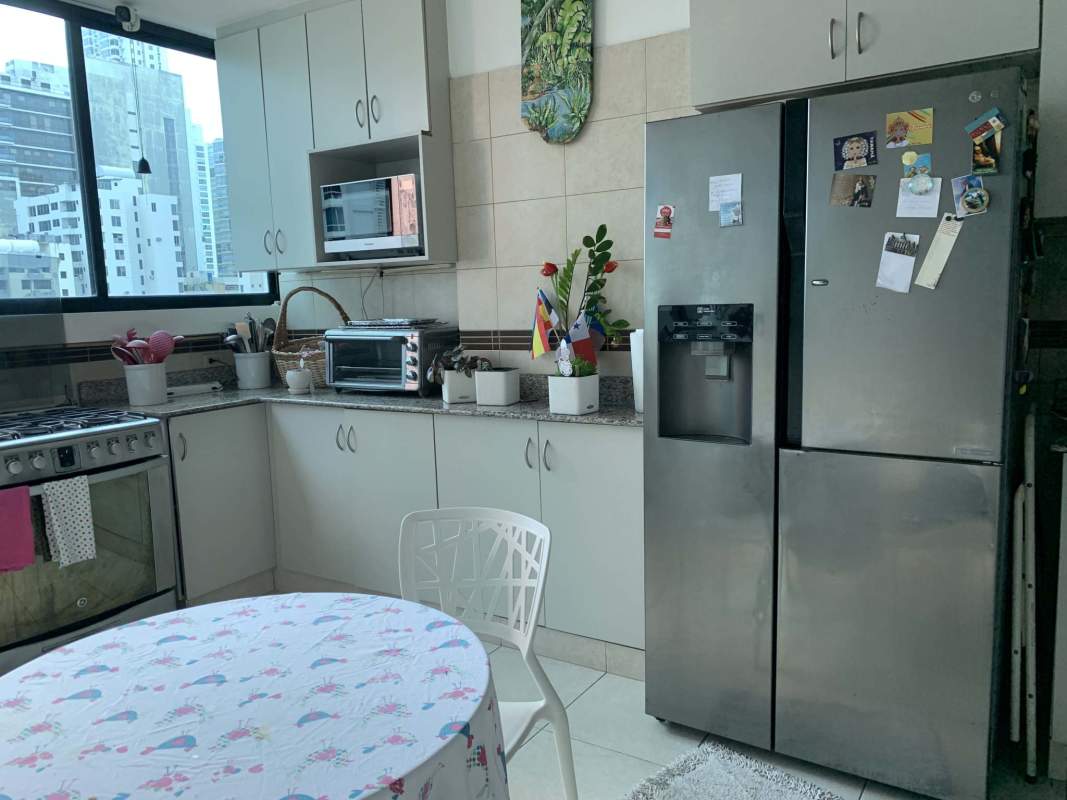 Kitchen with granite countertops, stainless appliances, window with city view at PH San Francisco Bay