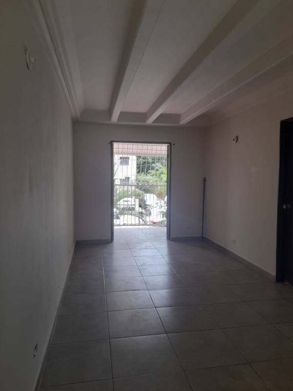 Living room with tiled flooring and large window Villa Gabriela Panama City