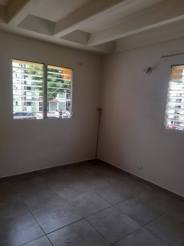 Bedroom with tile flooring and built-in closet Villa Gabriela Apartments