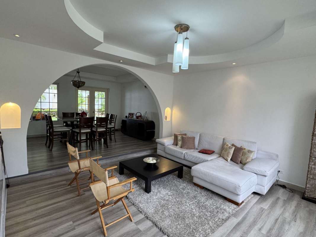 Open concept living-dining with archways and tray ceilings in Costa del Este Costa Azul residence