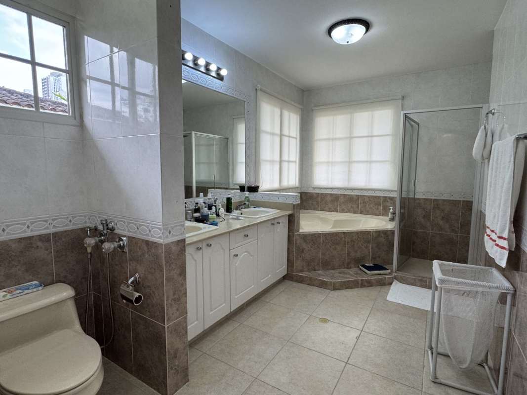 Bedroom featuring big windows, multiple closets, wood floor Costa del Este house