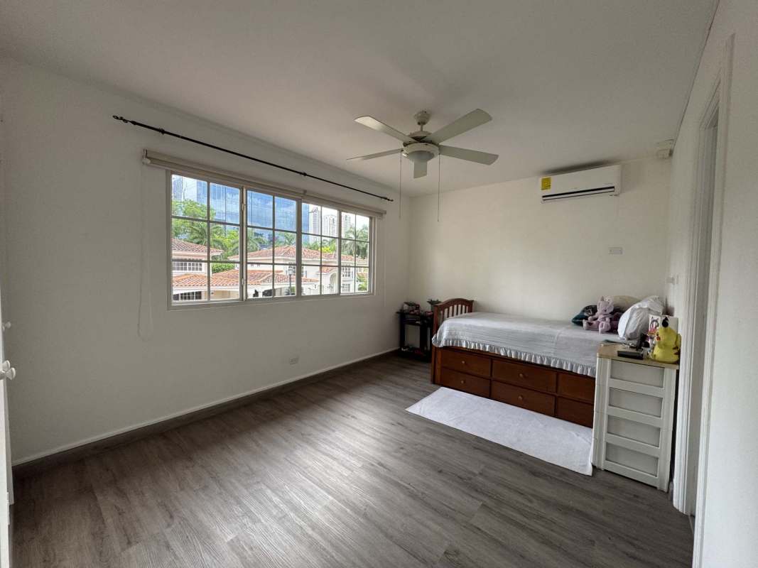 Covered terrace for outdoor living with dining furniture and garden in Costa del Este