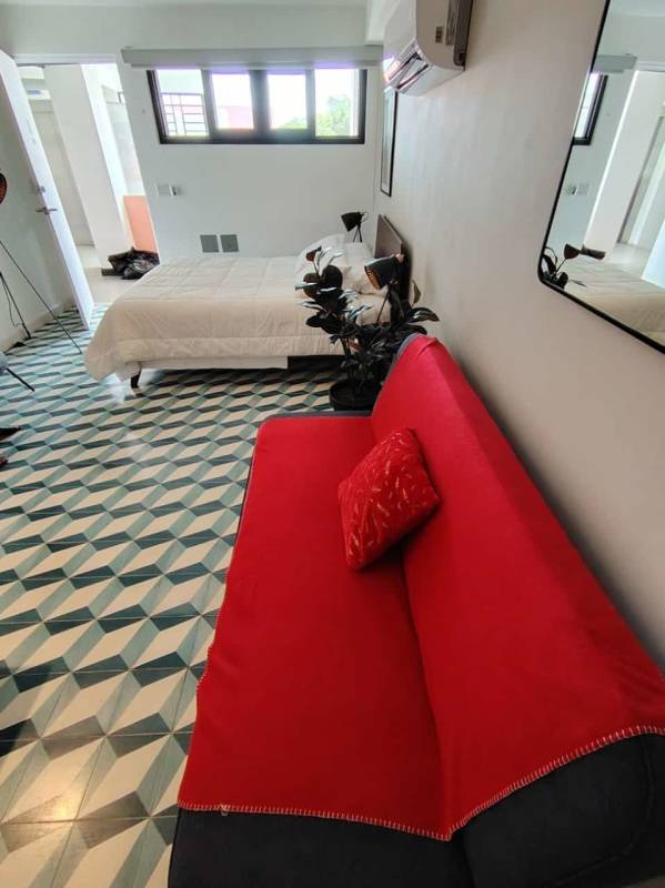 Bedroom and lounge in stylish studio with AC, sofa, modern decor Casco Antiguo Panama