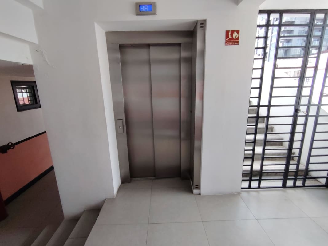 Hallway with elevator access in colonial style condo PH La Manzana Casco Viejo Panama