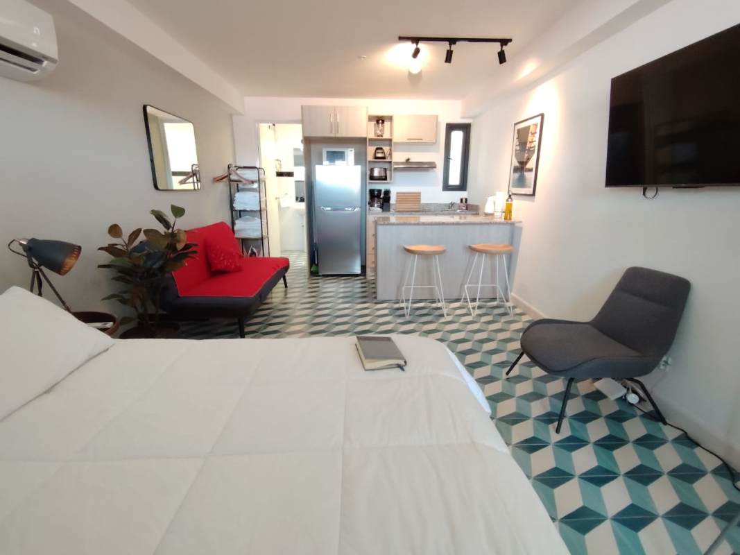 Bright furnished studio apartment with geometric tile flooring and open-plan kitchen PH La Manzana Casco Antiguo