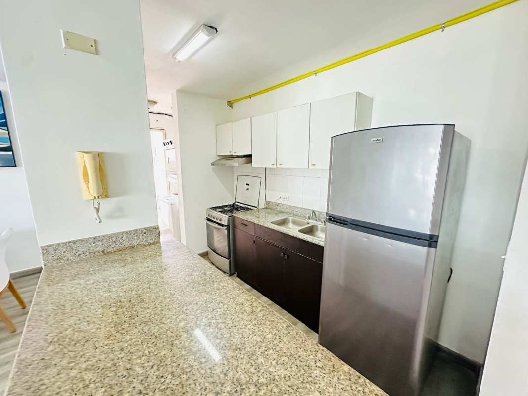 Bedroom with bright window, built-in closet, minimalist design in San Francisco apartment